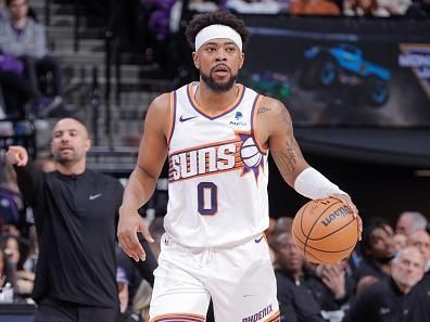 SACRAMENTO, CA - DECEMBER 22:  Jordan Goodwin #0 of the Phoenix Suns handles the ball during the game  on December 22, 2023 at Golden 1 Center in Sacramento, California. NOTE TO USER: User expressly acknowledges and agrees that, by downloading and or using this Photograph, user is consenting to the terms and conditions of the Getty Images License Agreement. Mandatory Copyright Notice: Copyright 2023 NBAE (Photo by Rocky Widner/NBAE via Getty Images)