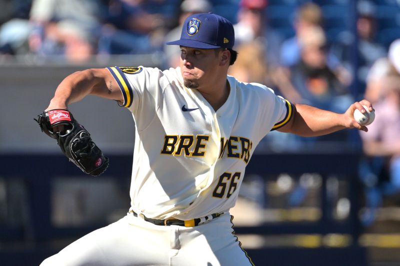 Feb 21, 2026; Phoenix, Arizona, USA;   Milwaukee Brewers pitcher Jesus Broca (66) delivers to the plate in the fourth inning against the Cleveland Guardians at American Family Fields of Phoenix. Mandatory Credit: Jayne Kamin-Oncea-Imagn Images