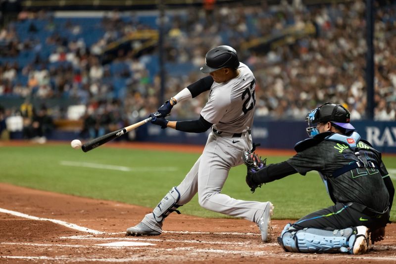 May 11, 2024; St. Petersburg, Florida, USA; New York Yankees outfielder Juan Soto (22) hits the ball against the Tampa Bay Rays during the third inning at Tropicana Field. Mandatory Credit: Matt Pendleton-USA TODAY Sports