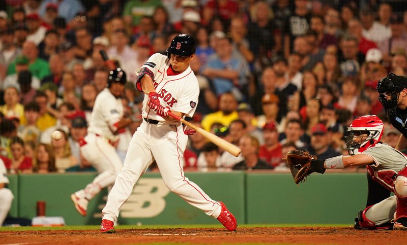 Jun 13, 2024; Boston, Massachusetts, USA; Boston Red Sox designated hitter Masataka Yoshida (7) gets a hit against the Philadelphia Phillies in the fourth inning at Fenway Park. Mandatory Credit: David Butler II-USA TODAY Sports