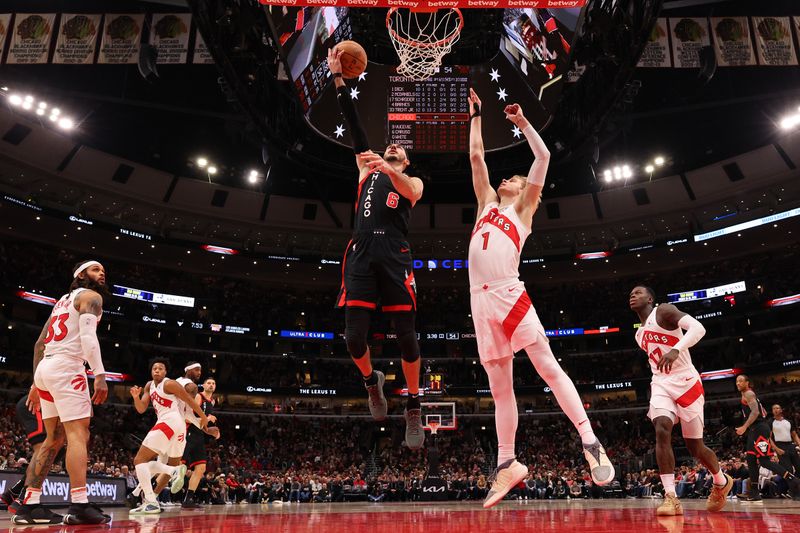 CHICAGO, ILLINOIS - JANUARY 30: Alex Caruso #6 of the Chicago Bulls goes up for a layup against the Toronto Raptors at the United Center on January 30, 2024 in Chicago, Illinois. NOTE TO USER: User expressly acknowledges and agrees that, by downloading and or using this photograph, User is consenting to the terms and conditions of the Getty Images License Agreement.  (Photo by Michael Reaves/Getty Images)