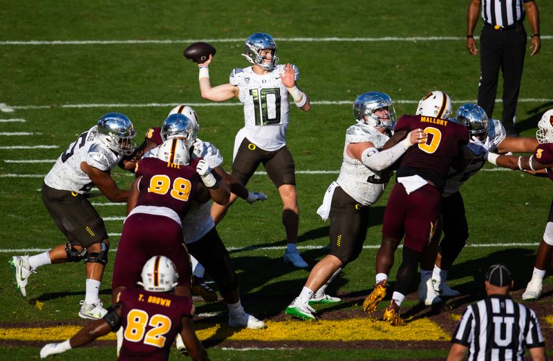 Nov 18, 2023; Tempe, Arizona, USA; Oregon Ducks quarterback Bo Nix (10) against the Arizona State Sun Devils in the first half at Mountain America Stadium. Mandatory Credit: Mark J. Rebilas-USA TODAY Sports