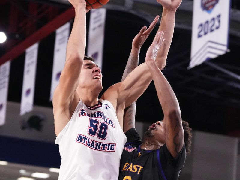 Jan 2, 2024; Boca Raton, Florida, USA; Florida Atlantic Owls center Vladislav Goldin (50) shoots over East Carolina Pirates forward Brandon Johnson (6) during the second half at Eleanor R. Baldwin Arena. Mandatory Credit: Rich Storry-USA TODAY Sports