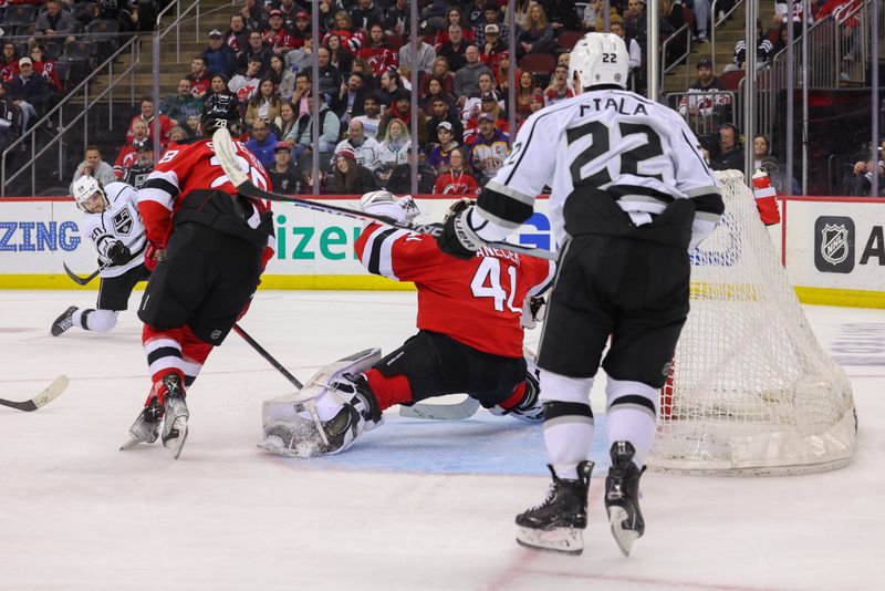 Feb 23, 2023; Newark, New Jersey, USA; Los Angeles Kings defenseman Sean Durzi (50) scores a goal on New Jersey Devils goaltender Vitek Vanecek (41) during the third period at Prudential Center. Mandatory Credit: Ed Mulholland-USA TODAY Sports