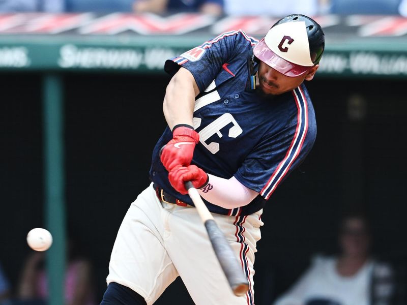 Jun 20, 2024; Cleveland, Ohio, USA; Cleveland Guardians first baseman Josh Naylor (22) hits an RBI double during the fifth inning against the Seattle Mariners at Progressive Field. Mandatory Credit: Ken Blaze-USA TODAY Sports