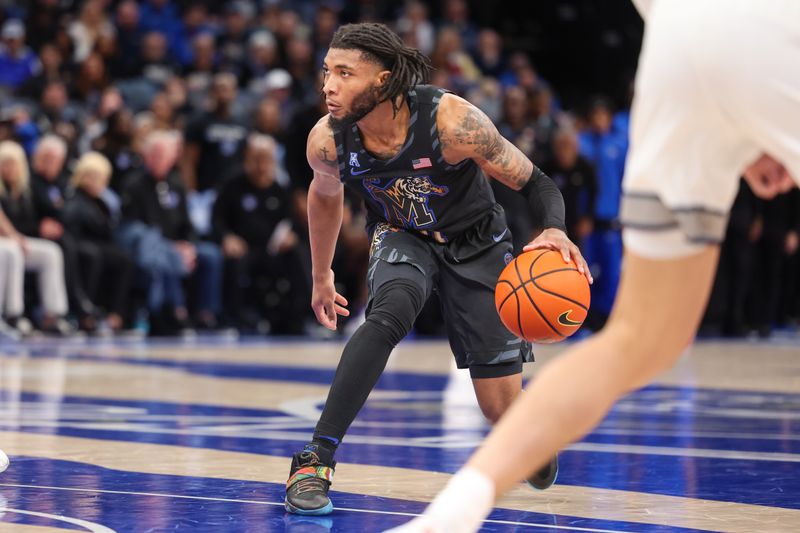 Feb 26, 2025; Memphis, Tennessee, USA; Memphis Tigers guard Tyrese Hunter (11) handles the ball against the Rice Owls during the first half at FedExForum. Mandatory Credit: Wesley Hale-Imagn Images