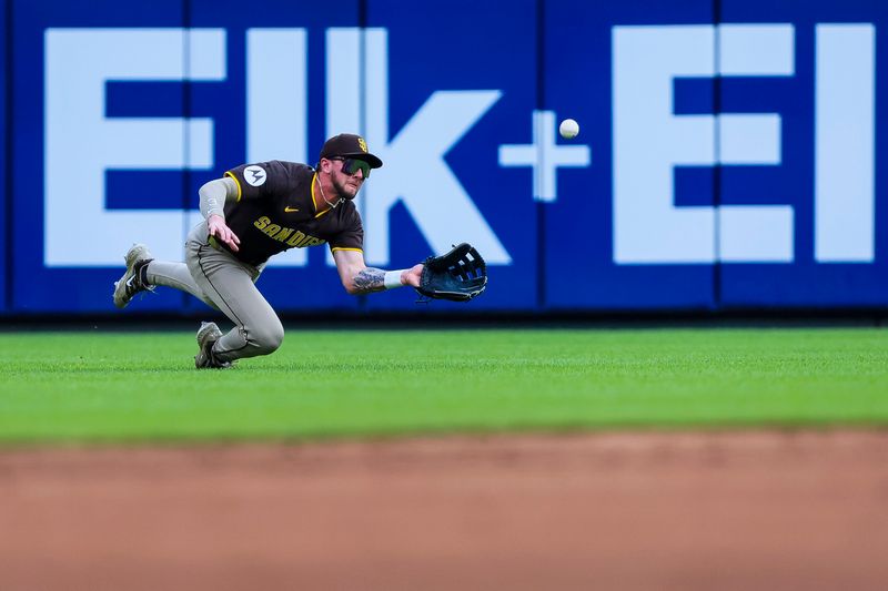 Jun 28, 2025; Cincinnati, Ohio, USA; San Diego Padres outfielder Jackson Merrill (3) attempts to catch a RBI single hit by Cincinnati Reds second baseman Matt McLain (not pictured) in the second inning at Great American Ball Park. Mandatory Credit: Katie Stratman-Imagn Images