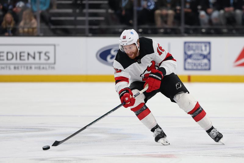 Dec 19, 2025; Salt Lake City, Utah, USA; New Jersey Devils right wing Connor Brown (16) advances the puck against the Utah Mammoth during the first period at Delta Center. Mandatory Credit: Rob Gray-Imagn Images