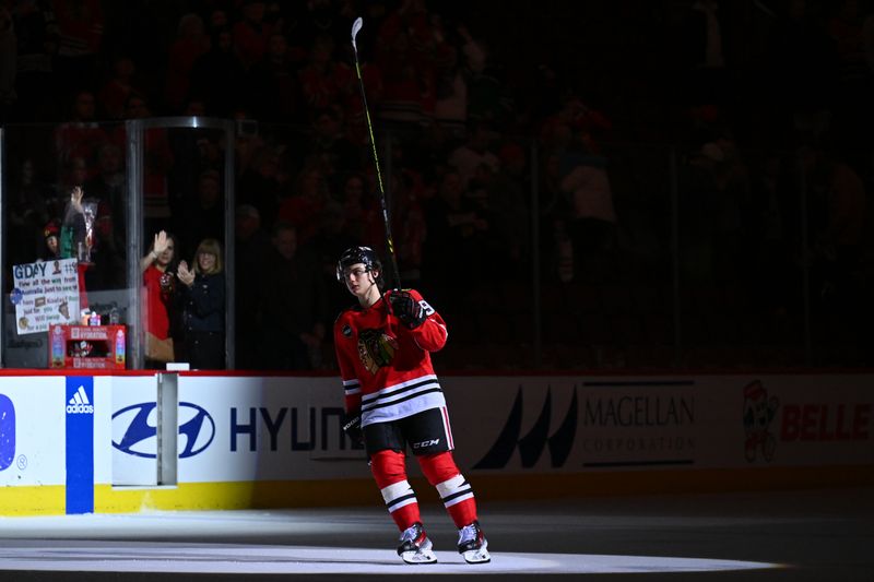 Dec 7, 2023; Chicago, Illinois, USA; Chicago Blackhawks forward Connor Bedard (98) takes a lap as the Second Star of the Game after Chicago defeated the Anaheim Ducks 1-0 at United Center. Mandatory Credit: Jamie Sabau-USA TODAY Sports