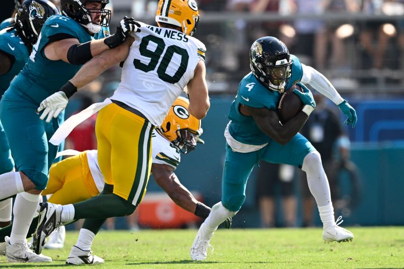 Jacksonville Jaguars' Tank Bigsby runs during the second half of an NFL football game against the Green Bay Packers Sunday, Oct. 27, 2024, in Jacksonville, Fla. (AP Photo/Phelan M. Ebenhack)