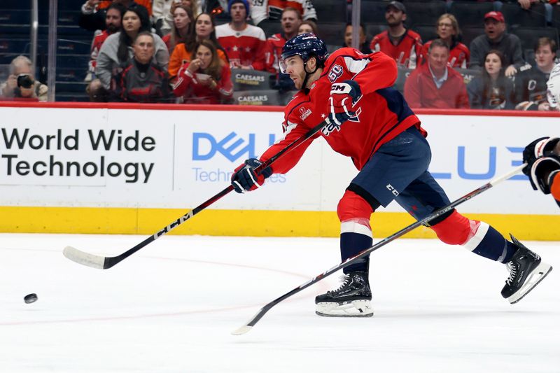 Mar 20, 2025; Washington, District of Columbia, USA; Washington Capitals right wing Taylor Raddysh (16) takes a shot during the first period against the Philadelphia Flyers at Capital One Arena. Mandatory Credit: Daniel Kucin Jr.-Imagn Images