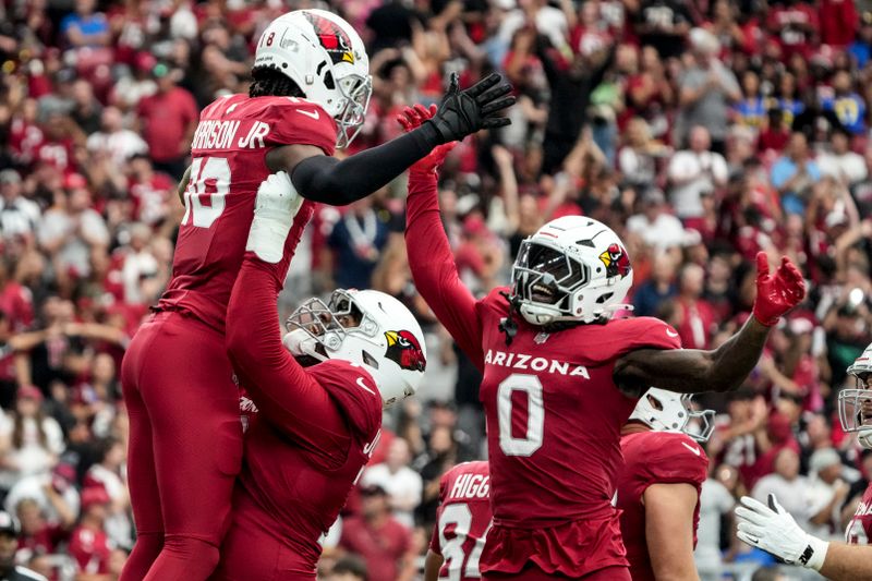 Arizona Cardinals wide receiver Marvin Harrison Jr. (18) celebrates his touchdown catch against the Los Angeles Rams during the first half of an NFL football game, Sunday, Sept. 15, 2024, in Glendale, Ariz. (AP Photo/Rick Scuteri)