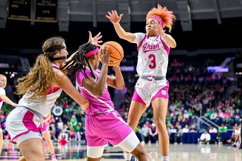 Feb 4, 2024; South Bend, Indiana, USA; Pittsburgh Panthers forward Liatu King (2) looks to pass as Notre Dame Fighting Irish forward Maddy Westbeld (21) and guard Hannah Hidalgo (3) defend in the first half at the Purcell Pavilion. Mandatory Credit: Matt Cashore-USA TODAY Sports