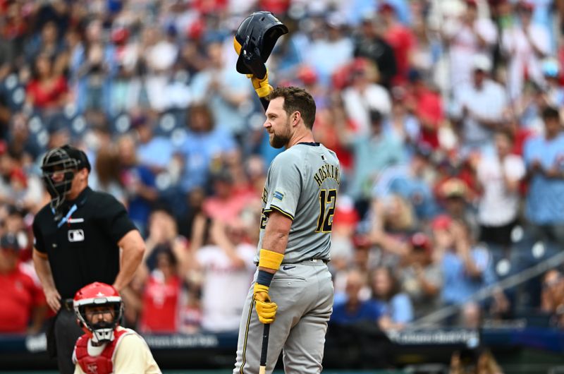 Jun 5, 2024; Philadelphia, Pennsylvania, USA; Milwaukee Brewers first baseman Rhys Hoskins (12) acknowledges the crowd against the Philadelphia Phillies in the second inning at Citizens Bank Park. Mandatory Credit: Kyle Ross-USA TODAY Sports