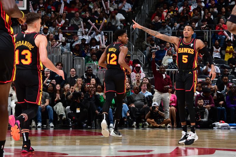 ATLANTA, GA - February 23:  Dejounte Murray #5 of the Atlanta Hawks reacts during the game against the Toronto Raptors on February 23, 2024 at State Farm Arena in Atlanta, Georgia.  NOTE TO USER: User expressly acknowledges and agrees that, by downloading and/or using this Photograph, user is consenting to the terms and conditions of the Getty Images License Agreement. Mandatory Copyright Notice: Copyright 2024 NBAE (Photo by Scott Cunningham/NBAE via Getty Images)