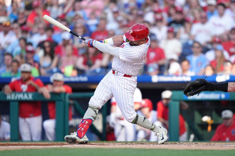 May 17, 2025; Philadelphia, Pennsylvania, USA; Philadelphia Phillies designated hitter Kyle Schwarber (12) hits an RBI double against the Pittsburgh Pirates in the first inning at Citizens Bank Park. Mandatory Credit: Kyle Ross-Imagn Images