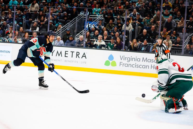 Feb 24, 2024; Seattle, Washington, USA; Minnesota Wild goaltender Marc-Andre Fleury (29) saves a shot by Seattle Kraken left wing Brandon Tanev (13) during the first period at Climate Pledge Arena. Mandatory Credit: Joe Nicholson-USA TODAY Sports