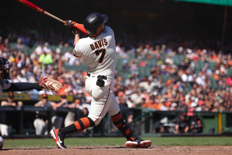 Sep 13, 2023; San Francisco, California, USA; San Francisco Giants third baseman J.D. Davis (7) hits a three run home run during the eighth inning against the Cleveland Guardians at Oracle Park. Mandatory Credit: Sergio Estrada-USA TODAY Sports