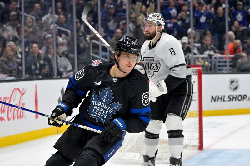 Jan 2, 2024; Los Angeles, California, USA; Toronto Maple Leafs right wing William Nylander (88) gets past Los Angeles Kings defenseman Drew Doughty (8) to score on an empty net in the third period at Crypto.com Arena. Mandatory Credit: Jayne Kamin-Oncea-USA TODAY Sports