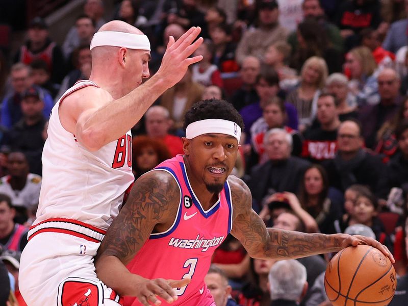 CHICAGO, ILLINOIS - FEBRUARY 26: Bradley Beal #3 of the Washington Wizards drives to the basket against Alex Caruso #6 of the Chicago Bulls during the first half at United Center on February 26, 2023 in Chicago, Illinois. NOTE TO USER: User expressly acknowledges and agrees that, by downloading and or using this photograph, User is consenting to the terms and conditions of the Getty Images License Agreement.  (Photo by Michael Reaves/Getty Images)