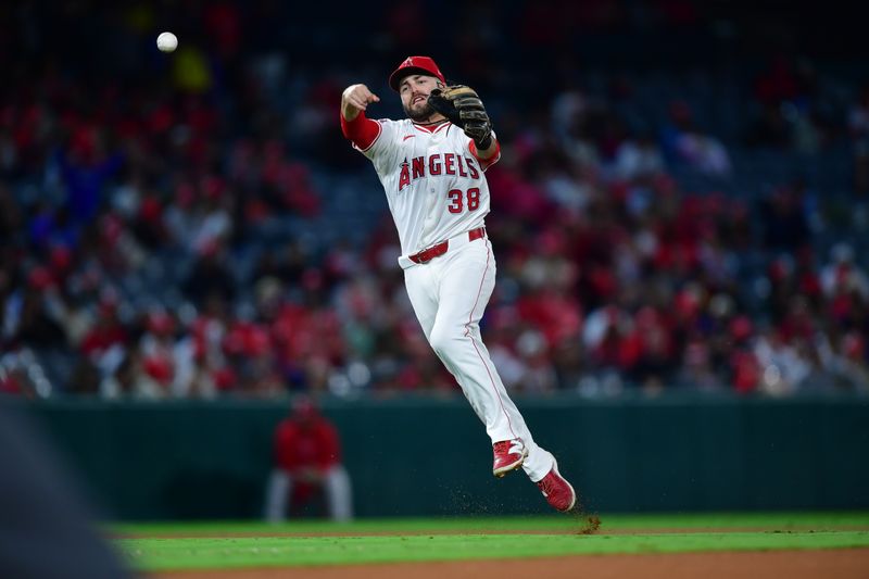 Sep 27, 2024; Anaheim, California, USA; Los Angeles Angels second baseman Michael Stefanic (38) throws to first for the out against Texas Rangers designated hitter Carson Kelly (18) during the ninth inning at Angel Stadium. Mandatory Credit: Gary A. Vasquez-Imagn Images