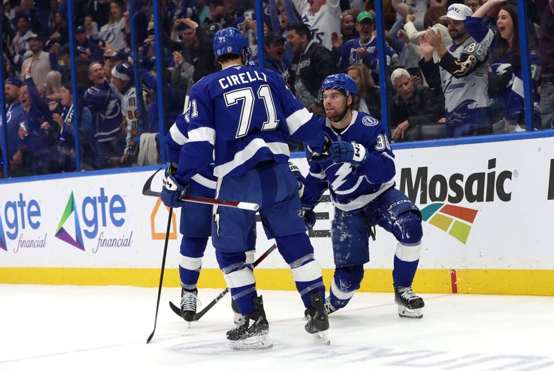 Dec 5, 2024; Tampa, Florida, USA; Tampa Bay Lightning left wing Brandon Hagel (38) is congratulated by center Anthony Cirelli (71) after he scored a goal against the San Jose Sharks during the first period at Amalie Arena. Mandatory Credit: Kim Klement Neitzel-Imagn Images