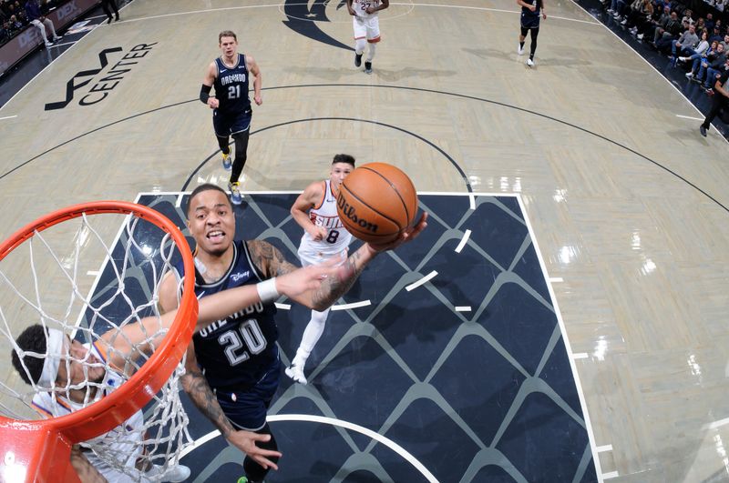 ORLANDO, FL - JANUARY 28: Markelle Fultz #20 of the Orlando Magic goes to the basket during the game on January 28, 2024 at Amway Center in Orlando, Florida. NOTE TO USER: User expressly acknowledges and agrees that, by downloading and or using this photograph, User is consenting to the terms and conditions of the Getty Images License Agreement. Mandatory Copyright Notice: Copyright 2024 NBAE (Photo by Fernando Medina/NBAE via Getty Images)