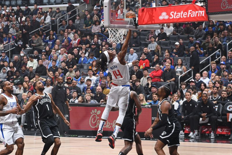 LOS ANGELES, CA - JANUARY 21: Terance Mann #14 of the LA Clippers drives to the basket during the game against the Brooklyn Nets on January 21, 2024 at Crypto.Com Arena in Los Angeles, California. NOTE TO USER: User expressly acknowledges and agrees that, by downloading and/or using this Photograph, user is consenting to the terms and conditions of the Getty Images License Agreement. Mandatory Copyright Notice: Copyright 2024 NBAE (Photo by Adam Pantozzi/NBAE via Getty Images)