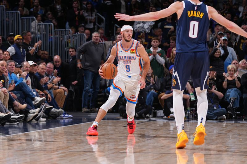 DENVER, CO - NOVEMBER 6: Alex Caruso #9 of the Oklahoma City Thunder dribbles the ball during the game against the Denver Nuggets  during a regular season game on November 6, 2024 at Ball Arena in Denver, Colorado. NOTE TO USER: User expressly acknowledges and agrees that, by downloading and/or using this Photograph, user is consenting to the terms and conditions of the Getty Images License Agreement. Mandatory Copyright Notice: Copyright 2024 NBAE (Photo by Bart Young/NBAE via Getty Images)