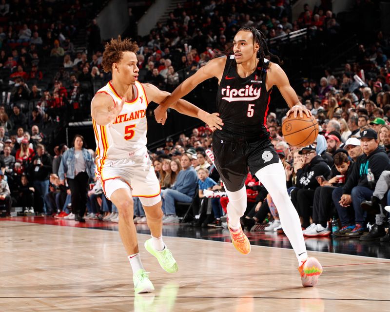 PORTLAND, OR - November 17:  Dalano Banton #5 of the Portland Trail Blazers dribbles the ball during the game against the Atlanta Hawks on November 17, 2024 at the Moda Center Arena in Portland, Oregon. NOTE TO USER: User expressly acknowledges and agrees that, by downloading and or using this photograph, user is consenting to the terms and conditions of the Getty Images License Agreement. Mandatory Copyright Notice: Copyright 2024 NBAE (Photo by Cameron Browne/NBAE via Getty Images)