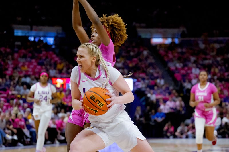 Feb 11, 2024; Baton Rouge, Louisiana, USA; LSU Lady Tigers guard Hailey Van Lith (11) dribbles past Alabama Crimson Tide guard Loyal McQueen (0) during the first half at Pete Maravich Assembly Center. Mandatory Credit: Matthew Hinton-USA TODAY Sports