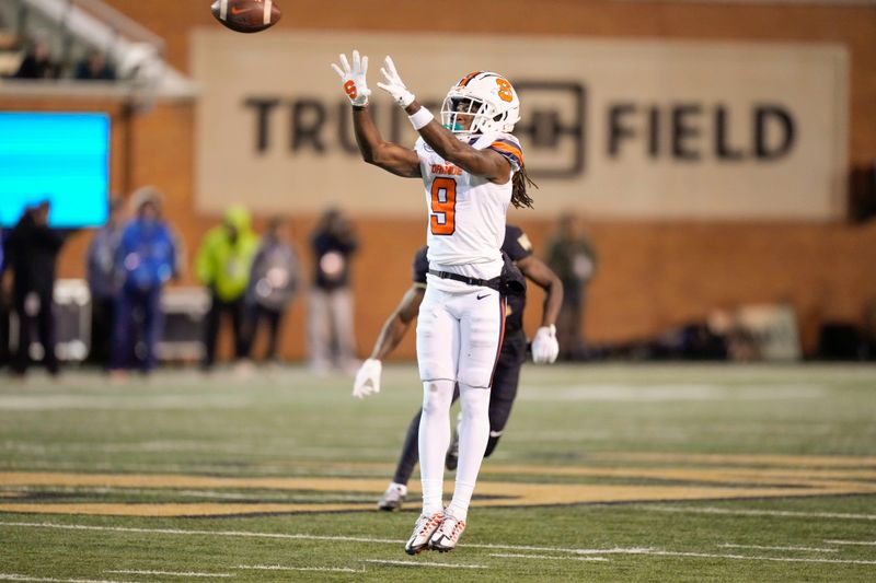 Nov 19, 2022; Winston-Salem, North Carolina, USA; Syracuse Orange wide receiver Courtney Jackson (9) jumps up for the reception against the Wake Forest Demon Deacons during the second half at Truist Field. Mandatory Credit: Jim Dedmon-USA TODAY Sports