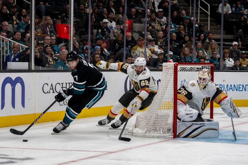 Feb 19, 2024; San Jose, California, USA; San Jose Sharks center Nico Sturm (7) controls the puck behind the net against Vegas Golden Knights defenseman Daniil Miromanov (62) during the second period at SAP Center at San Jose. Mandatory Credit: Neville E. Guard-USA TODAY Sports