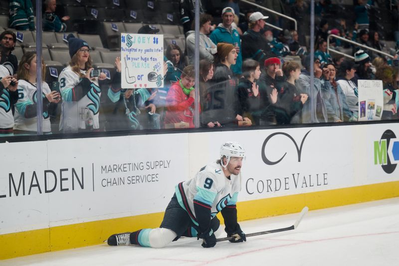 Nov 29, 2024; San Jose, California, USA; Seattle Kraken center Chandler Stephenson (9) stretches on the ice before the game against the San Jose Sharks at SAP Center at San Jose. Mandatory Credit: Robert Edwards-Imagn Images