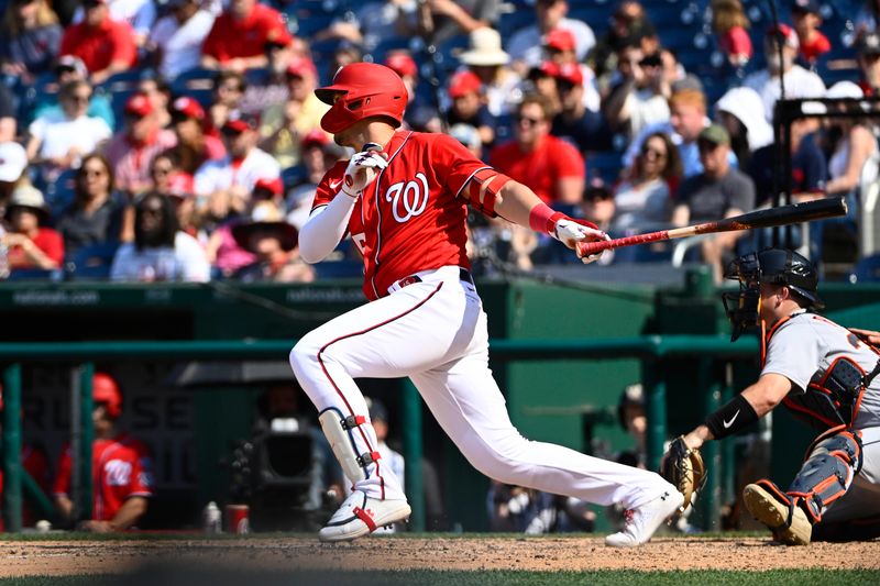 May 21, 2023; Washington, District of Columbia, USA; Washington Nationals designated hitter Joey Meneses (45) singles against the Detroit Tigers during the eighth inning at Nationals Park. Mandatory Credit: Brad Mills-USA TODAY Sports