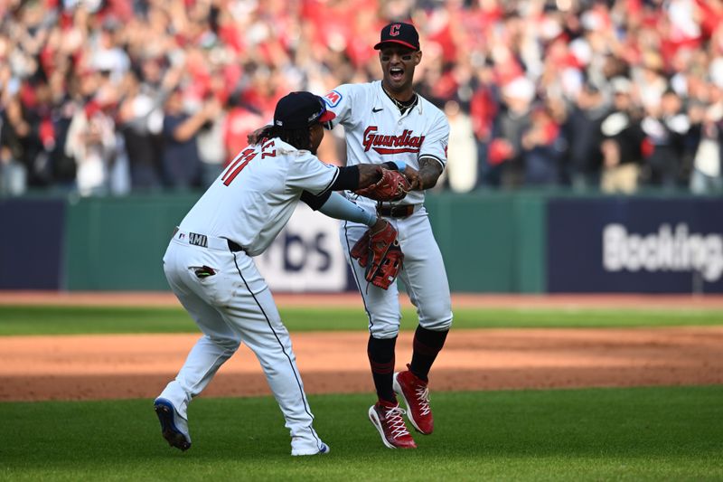 Oct 12, 2024; Cleveland, Ohio, USA; Cleveland Guardians third base José Ramírez (11) celebrates with shortstop Brayan Rocchio (4) after defeating the Detroit Tigers during game five of the ALDS for the 2024 MLB Playoffs at Progressive Field. Mandatory Credit: Ken Blaze-Imagn Images