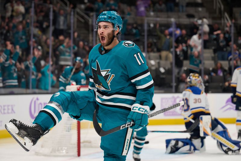 Nov 16, 2023; San Jose, California, USA; San Jose Sharks center Luke Kunin (11) reacts after scoring a goal against St. Louis Blues goaltender Joel Hofer (30) during the second period at SAP Center at San Jose. Mandatory Credit: Robert Edwards-USA TODAY Sports