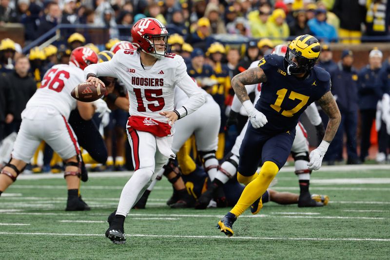 Oct 14, 2023; Ann Arbor, Michigan, USA; Indiana Hoosiers quarterback Brendan Sorsby (15) scrambles in the first half against the Michigan Wolverines at Michigan Stadium. Mandatory Credit: Rick Osentoski-USA TODAY Sports