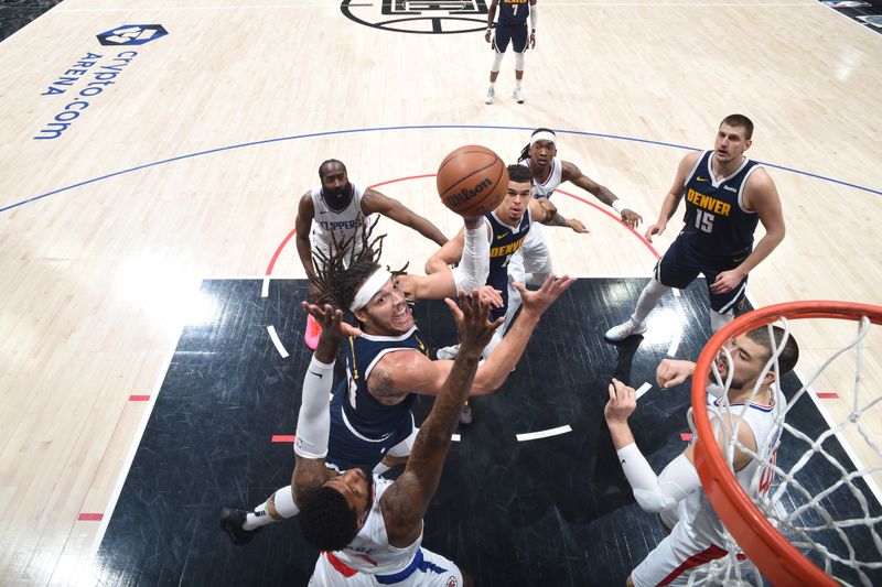 LOS ANGELES, CA - APRIL 4: Aaron Gordon #50 of the Denver Nuggets drives to the basket during the game against the LA Clippers on April 4, 2024 at Crypto.Com Arena in Los Angeles, California. NOTE TO USER: User expressly acknowledges and agrees that, by downloading and/or using this Photograph, user is consenting to the terms and conditions of the Getty Images License Agreement. Mandatory Copyright Notice: Copyright 2024 NBAE (Photo by Adam Pantozzi/NBAE via Getty Images)