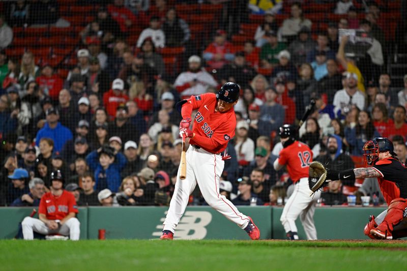 Sep 22, 2024; Boston, MA, USA;  Boston Red Sox designated hitter Masataka Yoshida (7) hits an RBI single against the Minnesota Twins during the sixth inning at Fenway Park. Mandatory Credit: Eric Canha-Imagn Images