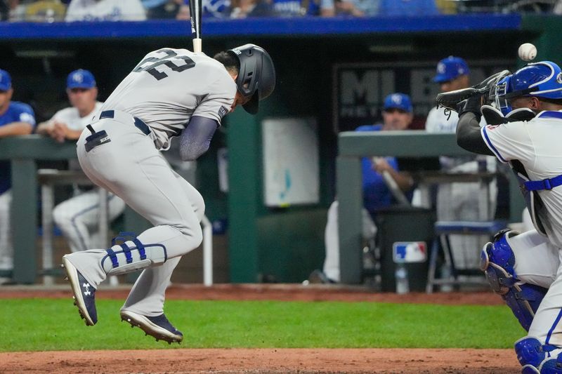 Jun 12, 2024; Kansas City, Missouri, USA; New York Yankees right fielder Juan Soto (22) is hit by a pitch against the Kansas City Royals in the seventh inning at Kauffman Stadium. Mandatory Credit: Denny Medley-USA TODAY Sports