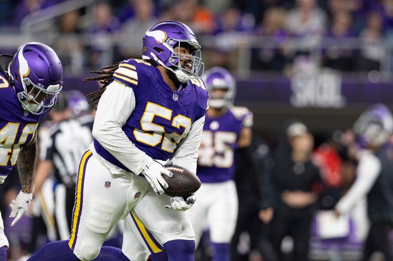 Minnesota Vikings defensive tackle Sheldon Day (52) reacts after a play during the second half of an NFL football game against the Chicago Bears, Monday, Nov. 27, 2023 in Minneapolis. Chicago won 12-10. (AP Photo/Stacy Bengs)