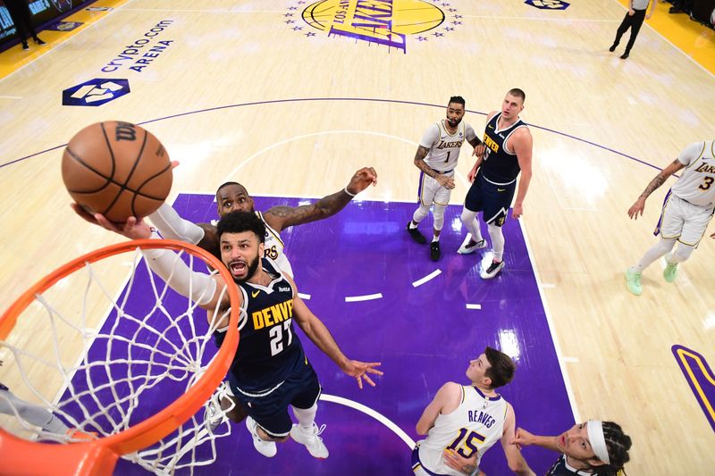 LOS ANGELES, CA - APRIL 27: Jamal Murray #27 of the Denver Nuggets drives to the basket during the game against the Los Angeles Lakers during Round 1 Game 4 of the 2024 NBA Playoffs on April 27, 2024 at Crypto.Com Arena in Los Angeles, California. NOTE TO USER: User expressly acknowledges and agrees that, by downloading and/or using this Photograph, user is consenting to the terms and conditions of the Getty Images License Agreement. Mandatory Copyright Notice: Copyright 2024 NBAE (Photo by Adam Pantozzi/NBAE via Getty Images)