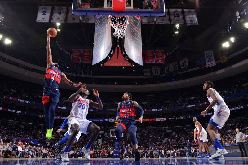 PHILADELPHIA, PA - JANUARY 8: Jared Butler #4 of the Washington Wizards drives to the basket during the game against the Philadelphia 76ers on January 8, 2025 at the Wells Fargo Center in Philadelphia, Pennsylvania NOTE TO USER: User expressly acknowledges and agrees that, by downloading and/or using this Photograph, user is consenting to the terms and conditions of the Getty Images License Agreement. Mandatory Copyright Notice: Copyright 2025 NBAE (Photo by Jesse D. Garrabrant/NBAE via Getty Images)