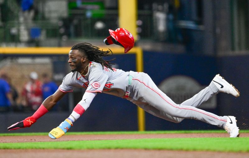 Apr 6, 2025; Milwaukee, Wisconsin, USA; Cincinnati Reds shortstop Elly De La Cruz (44) attempts to steal second base in the first inning against the Milwaukee Brewers but was called out at American Family Field. Mandatory Credit: Benny Sieu-Imagn Images