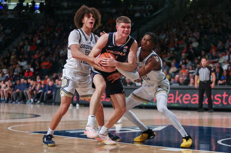 Jan 20, 2024; Atlanta, Georgia, USA; Virginia Cavaliers guard Isaac McKneely (11) is defended by Georgia Tech Yellow Jackets guard Naithan George (2) and guard Miles Kelly (13) in the second half at McCamish Pavilion. Mandatory Credit: Brett Davis-USA TODAY Sports