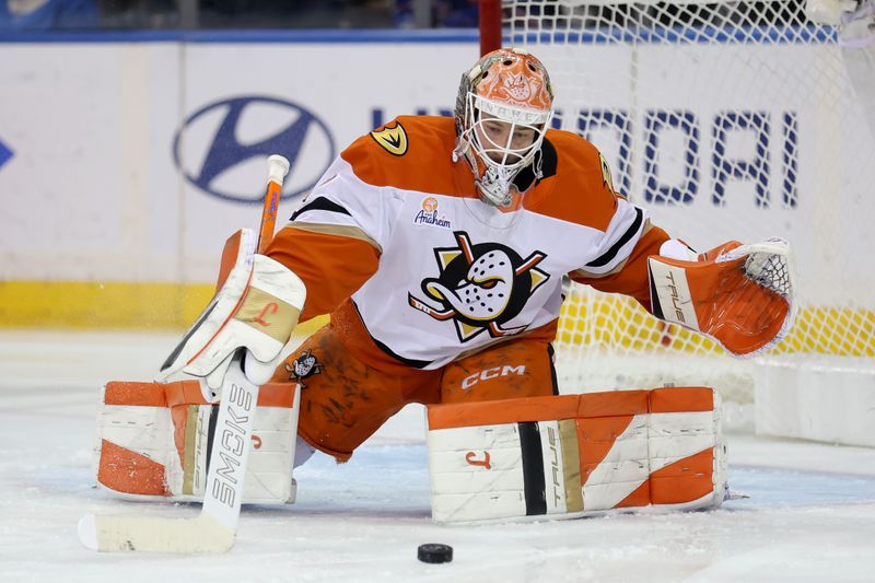 Dec 15, 2025; New York, New York, USA; Anaheim Ducks goaltender Lukas Dostal (1) plays the puck against the New York Rangers during the first period at Madison Square Garden. Mandatory Credit: Brad Penner-Imagn Images