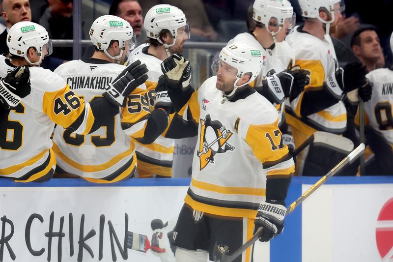 Feb 3, 2026; Elmont, New York, USA; Pittsburgh Penguins right wing Bryan Rust (17) celebrates his goal against the New York Islanders with teammates during the second period at UBS Arena. Mandatory Credit: Brad Penner-Imagn Images