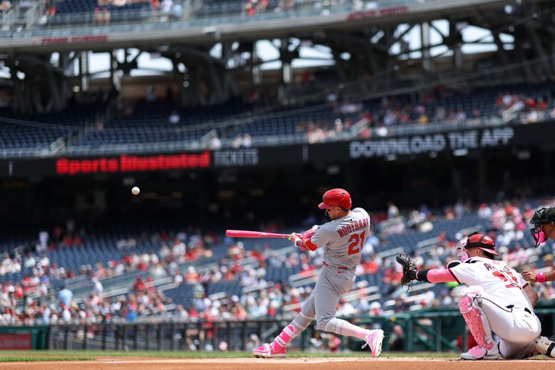 May 11, 2025; Washington, District of Columbia, USA; St. Louis Cardinals outfielder Lars Nootbaar (21) hits a solo home run against the Washington Nationals during the first inning at Nationals Park. Mandatory Credit: Geoff Burke-Imagn Images