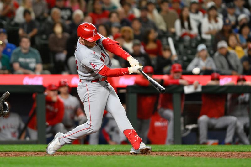 Sep 11, 2023; Seattle, Washington, USA; Los Angeles Angels second baseman Brandon Drury (23) hits a two-run home run against the Seattle Mariners during the tenth inning at T-Mobile Park. Mandatory Credit: Steven Bisig-USA TODAY Sports